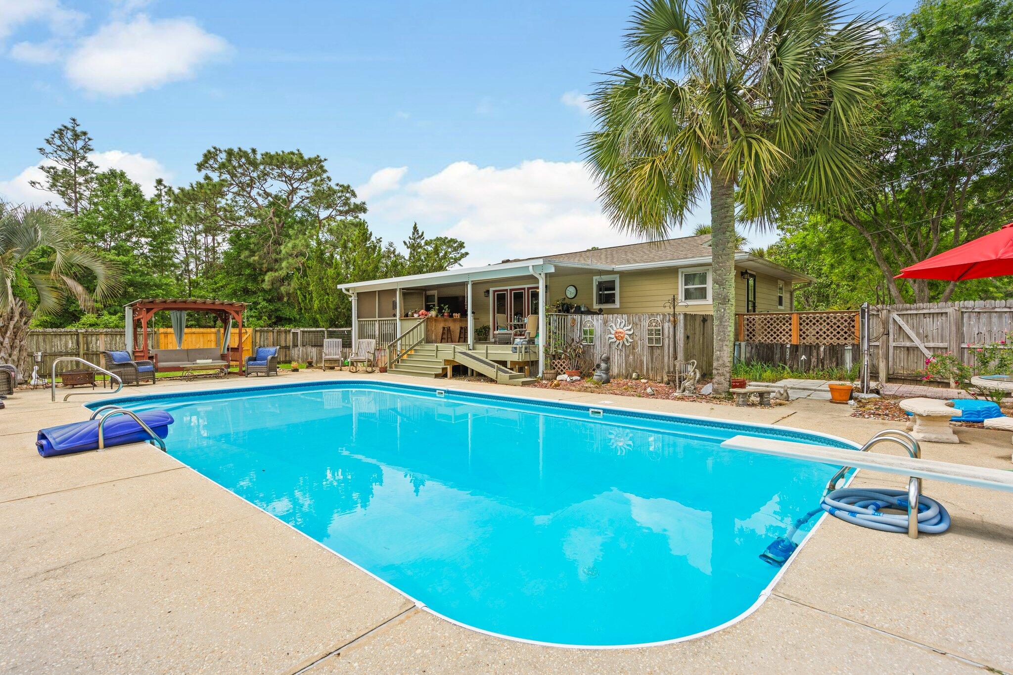1120 Tallokas Road Crestview, FL 32536 - Photo 36 of 55 a view of a house with swimming pool