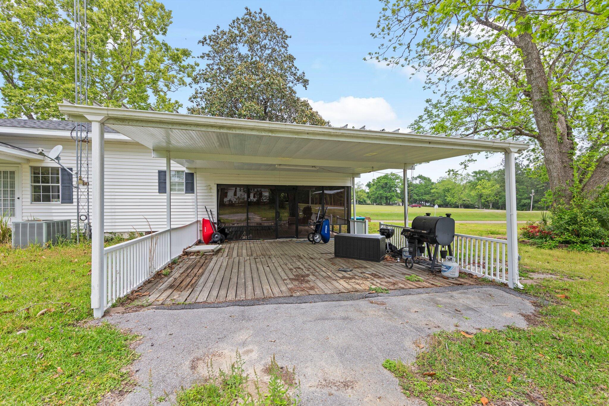 1120 Tallokas Road Crestview, FL 32536 - Photo 54 of 55 a view of a house with backyard and porch