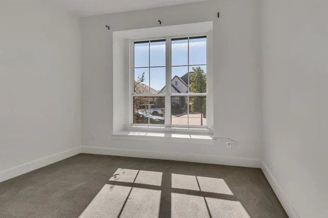 a bathroom with a glass shower door and a bathtub