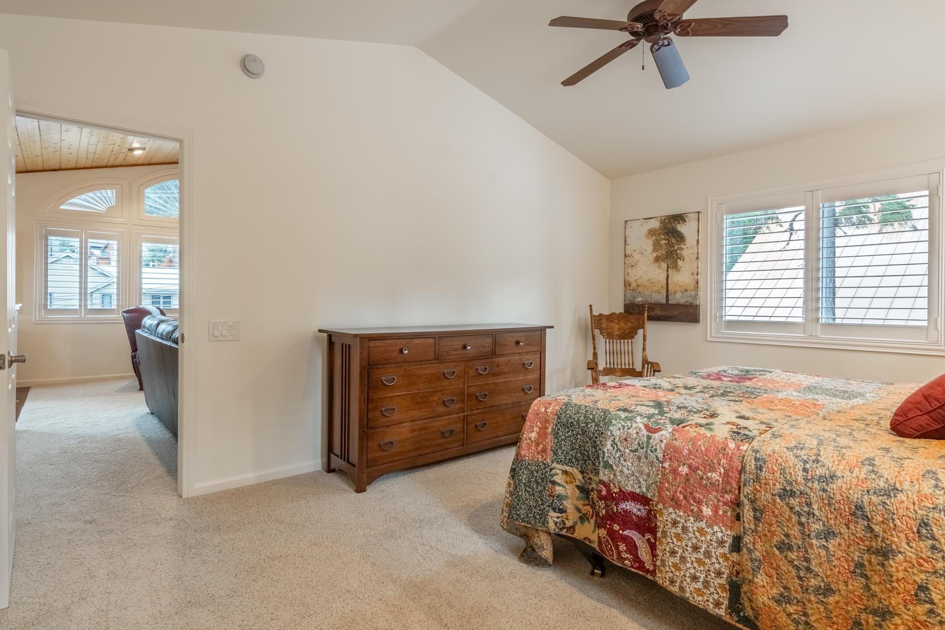 236 Davison Road Mammoth Lakes, CA 93546 - Photo 17 of 49 a bedroom with a bed and a chandelier