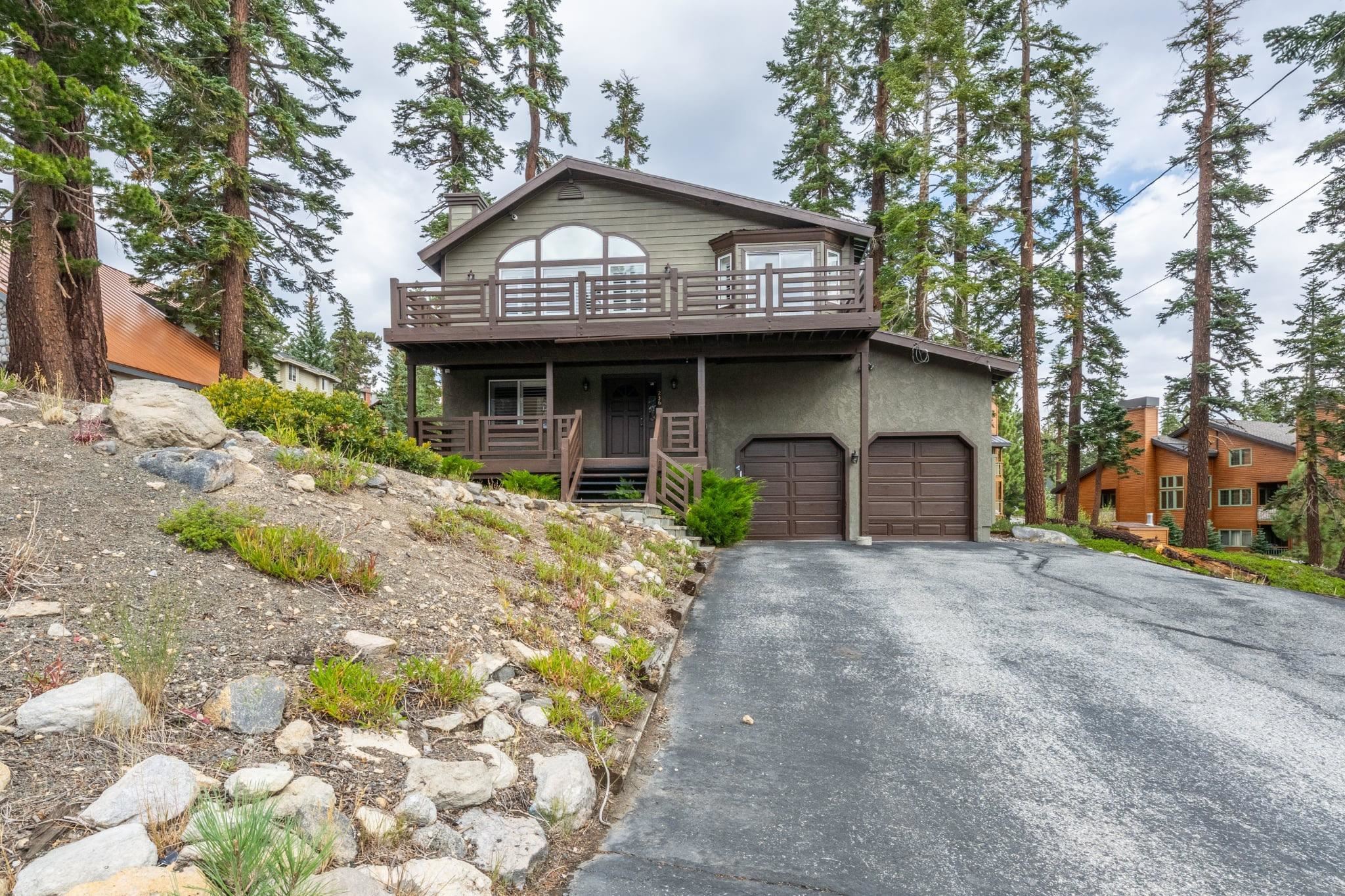 236 Davison Road Mammoth Lakes, CA 93546 - Photo 45 of 49 a front view of a house with a garden and plants