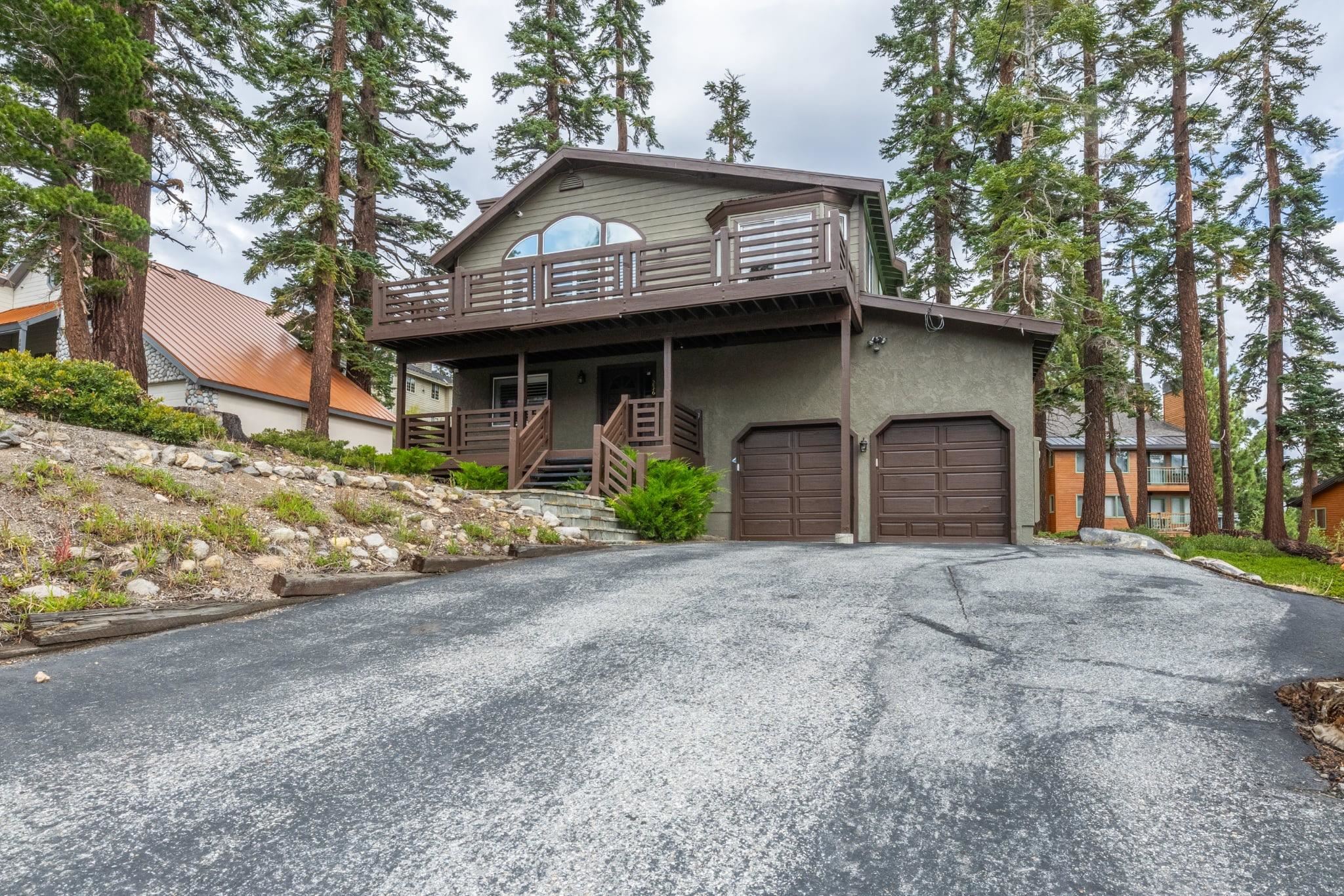 236 Davison Road Mammoth Lakes, CA 93546 - Photo 46 of 49 a front view of a house with a yard and garage