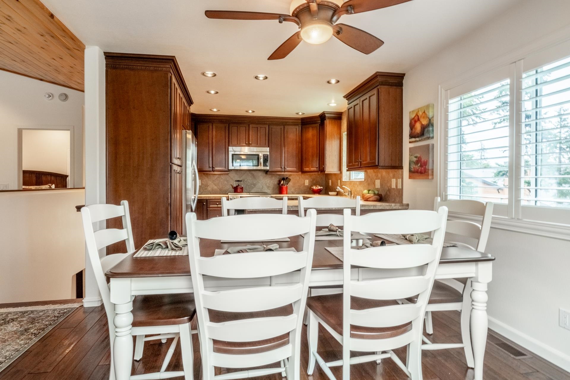 236 Davison Road Mammoth Lakes, CA 93546 - Photo 7 of 49 a kitchen with a dining table chairs and white appliances