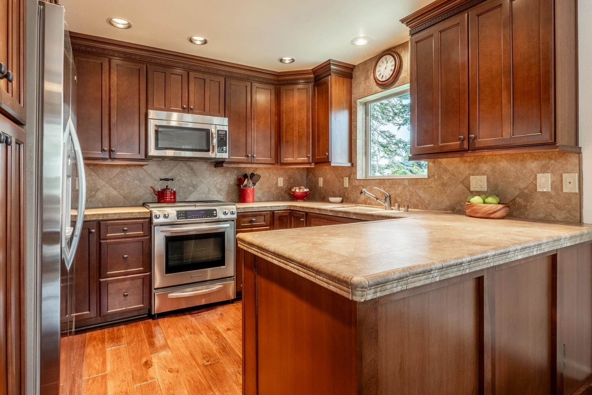 236 Davison Road Mammoth Lakes, CA 93546 - Photo 8 of 49 a kitchen with stainless steel appliances granite countertop a sink stove microwave and refrigerator