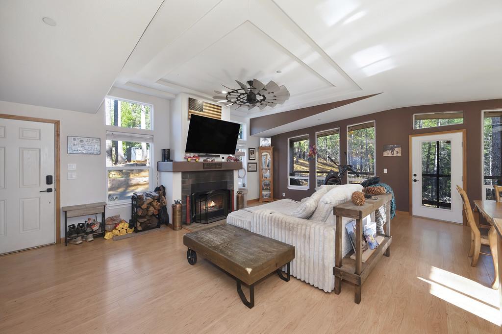 5060 Chestnut Court Georgetown, CA 95634 - Photo 20 of 65 a living room with furniture fireplace and a flat screen tv