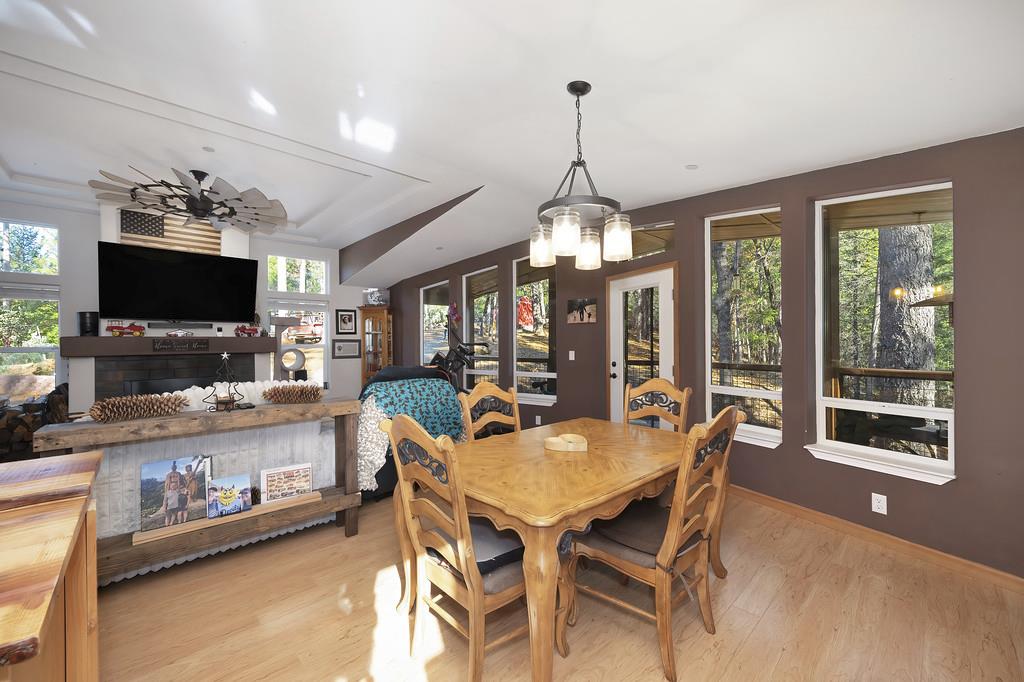 5060 Chestnut Court Georgetown, CA 95634 - Photo 25 of 65 a dining room with furniture a chandelier and window