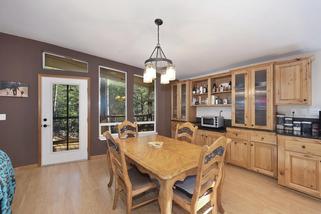 5060 Chestnut Court Georgetown, CA 95634 - Photo 29 of 65 dining room featuring suspended lighting and light wood-style flooring