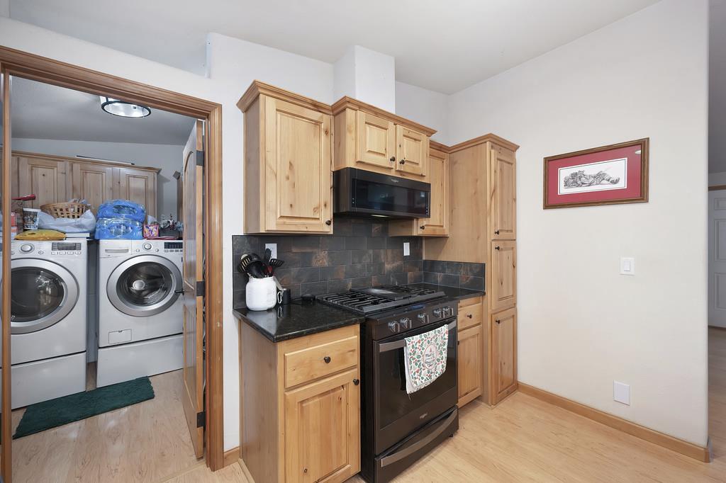 5060 Chestnut Court Georgetown, CA 95634 - Photo 32 of 65 a kitchen with stainless steel appliances granite countertop a stove and a microwave