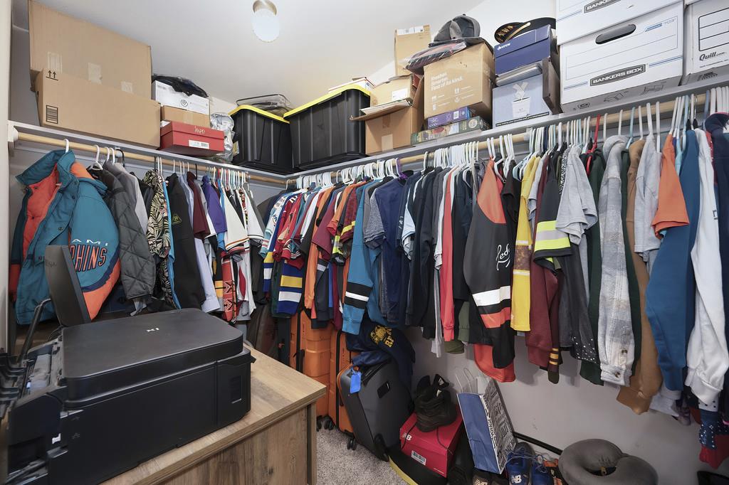 5060 Chestnut Court Georgetown, CA 95634 - Photo 43 of 65 a view of walk in closet with clothes and shoes