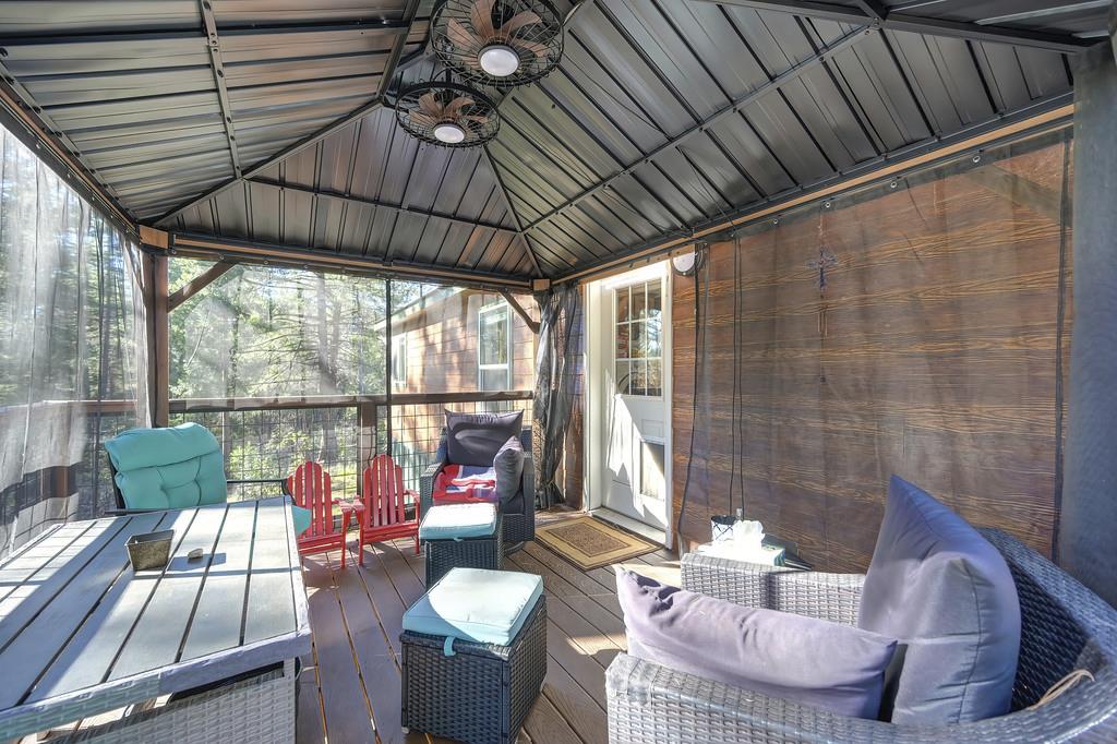 5060 Chestnut Court Georgetown, CA 95634 - Photo 50 of 65 sunroom with lofted ceiling and a deck