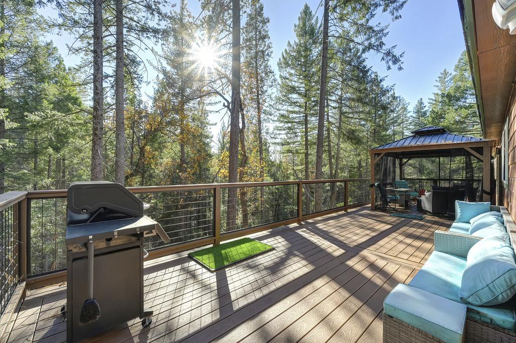 5060 Chestnut Court Georgetown, CA 95634 - Photo 54 of 65 deck featuring a gazebo, grilling area, and view of scattered trees