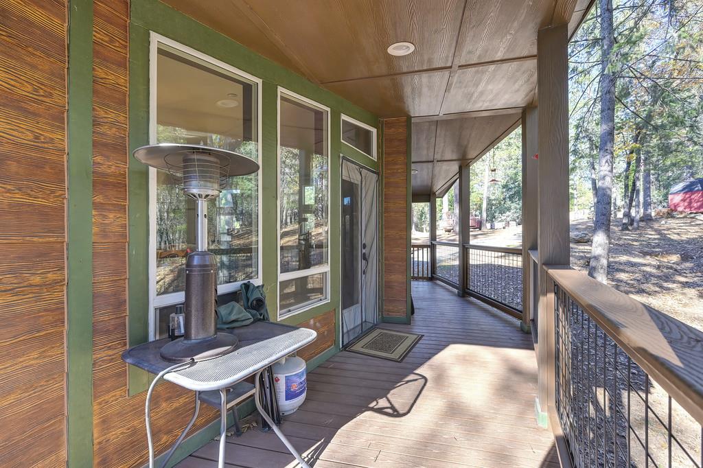 5060 Chestnut Court Georgetown, CA 95634 - Photo 55 of 65 a view of a patio with a dining table and chairs
