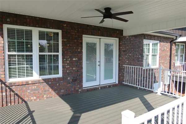 a view of a balcony with a dining space