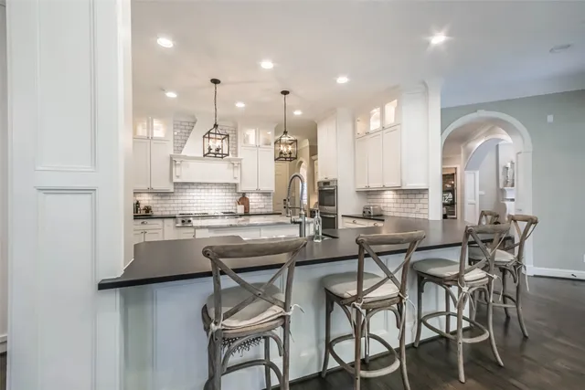 a kitchen with a table and chairs in it