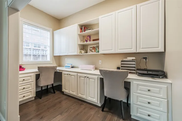 a kitchen with a white cabinets and white appliances