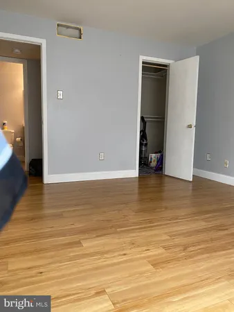 an empty room with wooden floor