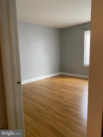 a white toilet sitting next to a bath tub