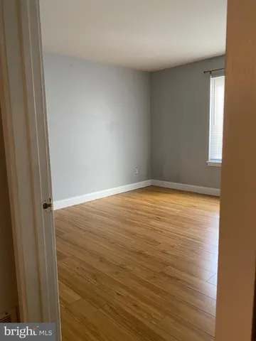 a white toilet sitting next to a bath tub
