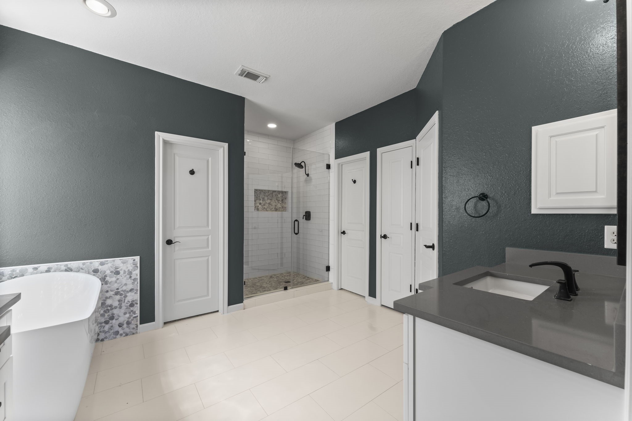 19218 Country Village Drive Spring, TX 77388 - Photo 17 of 30 a spacious bathroom with a bathtub sink and mirror