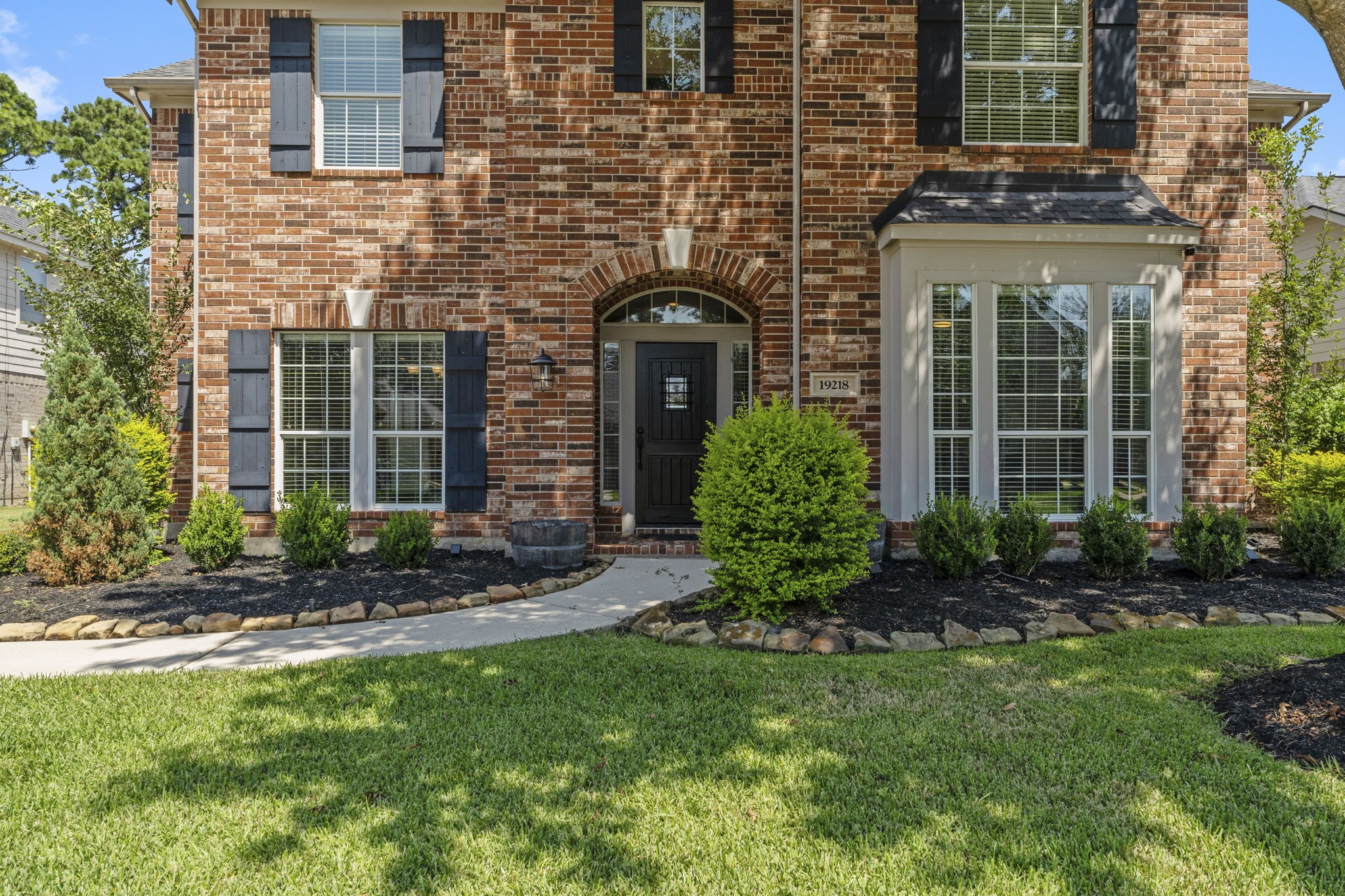 19218 Country Village Drive Spring, TX 77388 - Photo 2 of 30 a front view of a house with garden