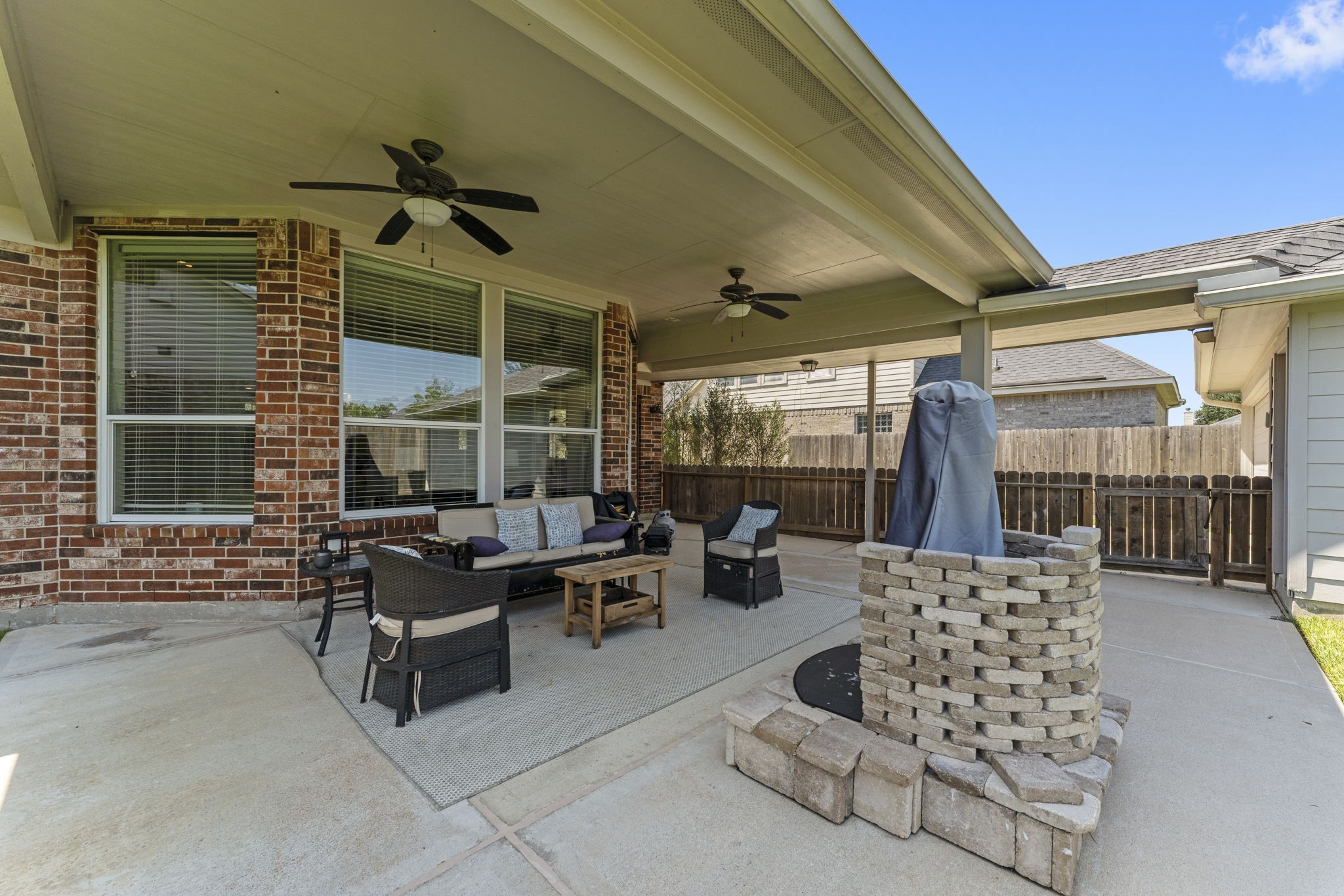 19218 Country Village Drive Spring, TX 77388 - Photo 26 of 30 a outdoor space with patio the couches and a dining table with the garden view