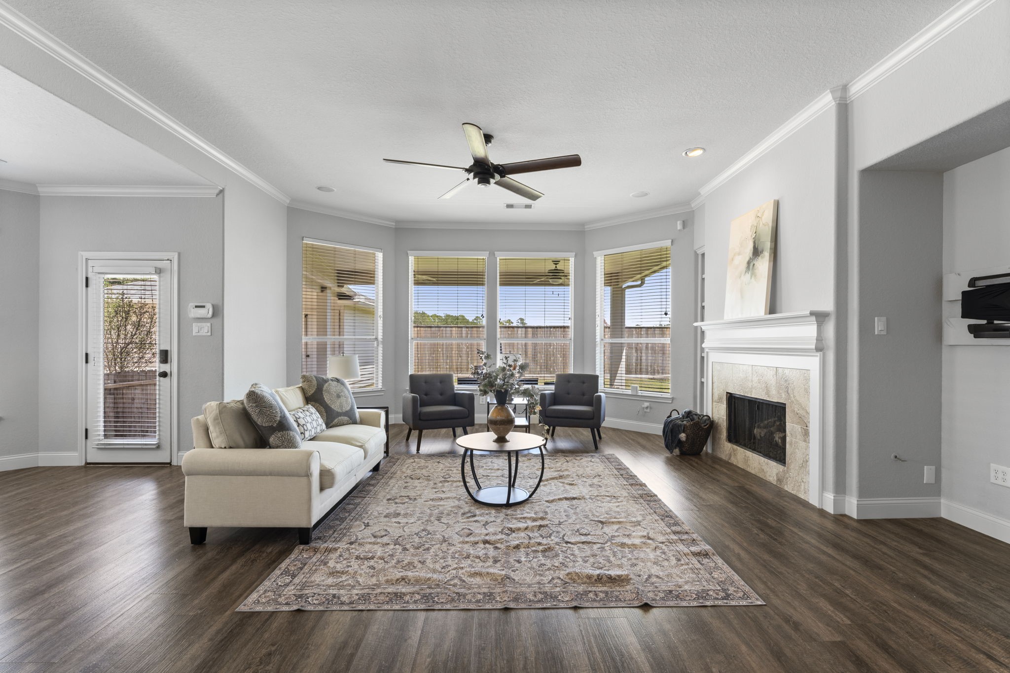 19218 Country Village Drive Spring, TX 77388 - Photo 8 of 30 a living room with furniture fireplace and a large window
