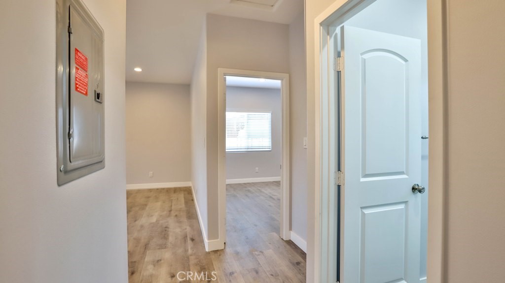 1246 South Baker Street Santa Ana, CA 92707 - Photo 13 of 19 a view of a bathroom from a corridor