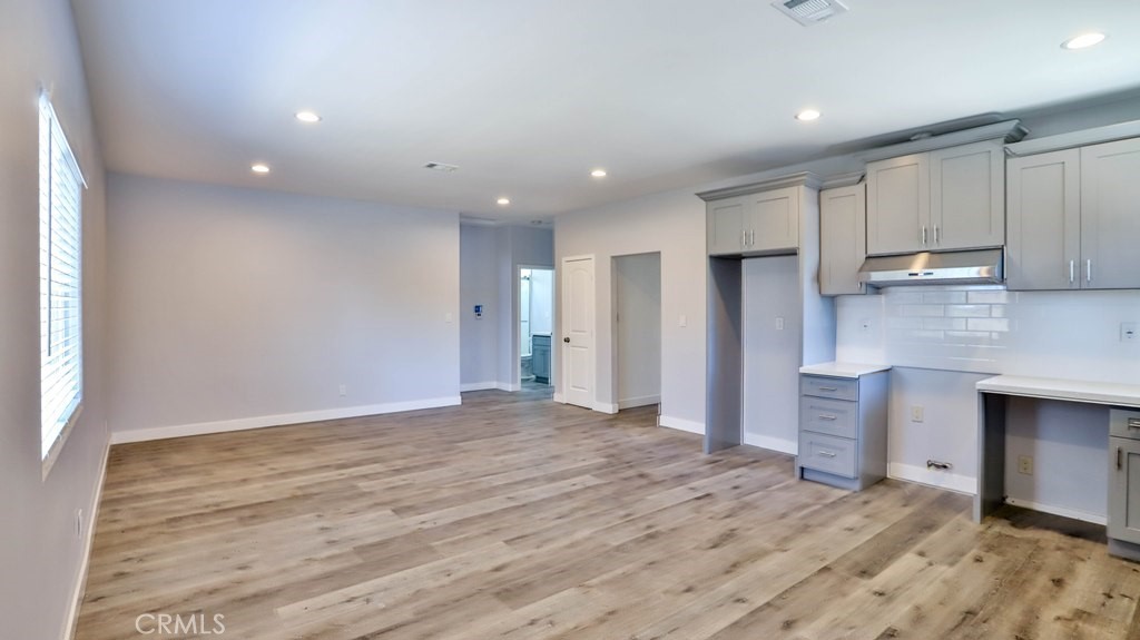 1246 South Baker Street Santa Ana, CA 92707 - Photo 5 of 19 a view of a kitchen with a sink and dishwasher cabinets