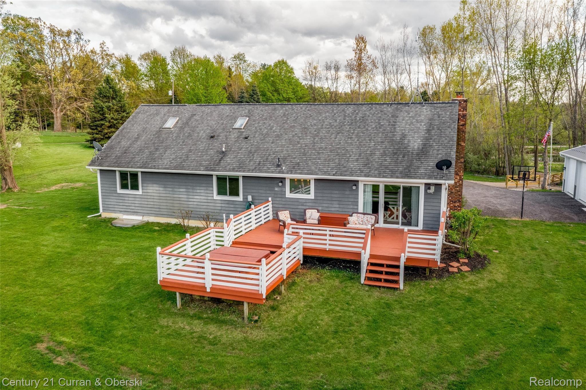 16920 Heim Road Chelsea, MI 48118 - Photo 40 of 48 Backyard with Big Deck