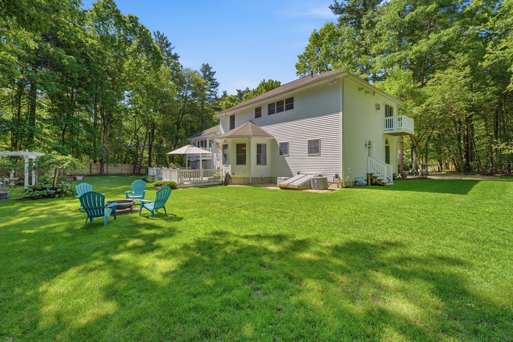 25 Haymeadow Road Boxford, MA 01921 - Photo 33 of 42 a front view of house with yard and outdoor seating