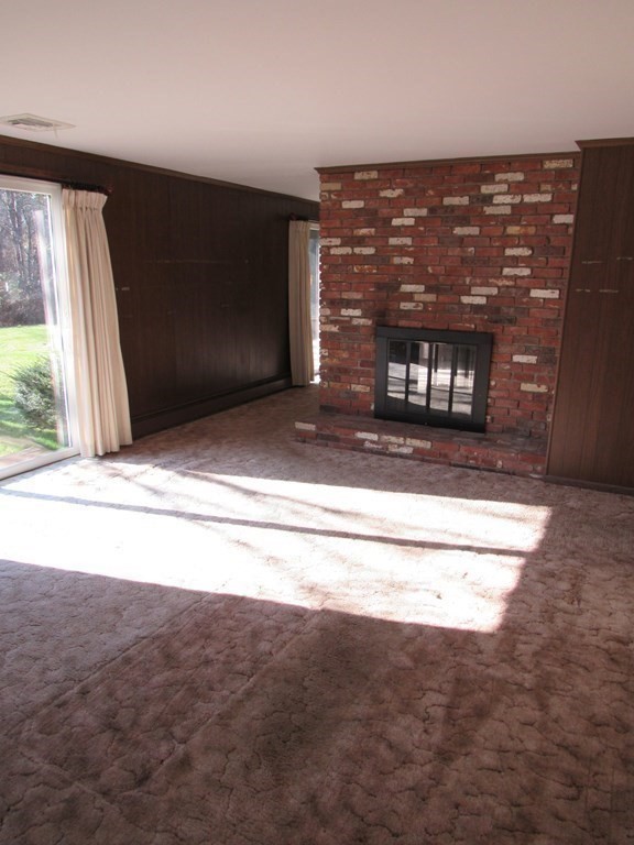 144 Harvard Road Stow, MA 01775 - Photo 13 of 40 a view of fireplace and window