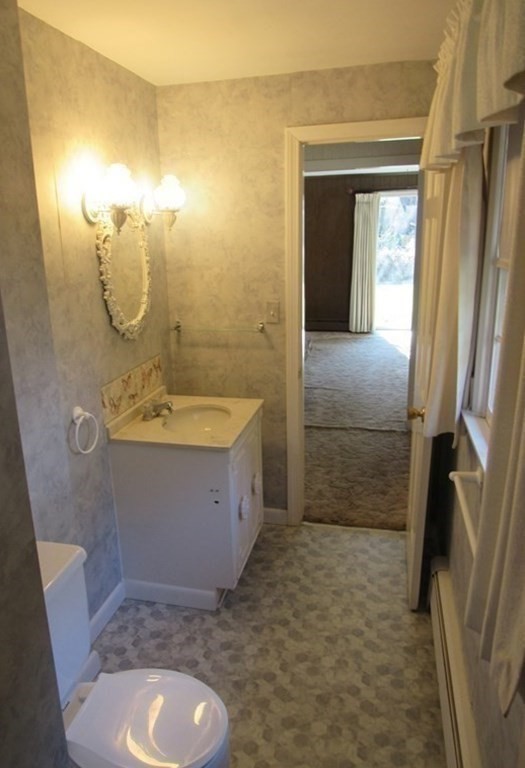 144 Harvard Road Stow, MA 01775 - Photo 17 of 40 a bathroom with a sink a toilet and shower