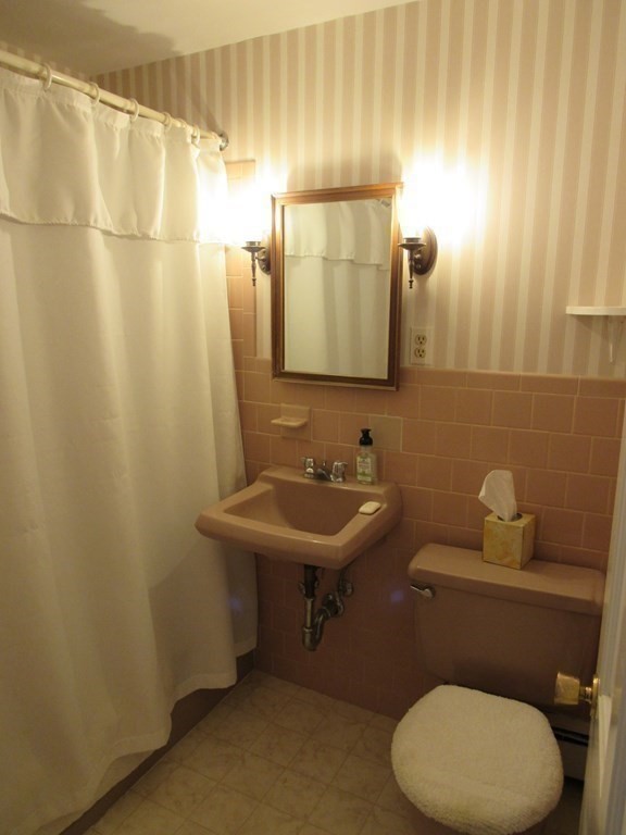 144 Harvard Road Stow, MA 01775 - Photo 18 of 40 a bathroom with a sink a toilet and mirror