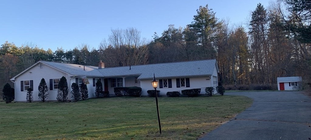 144 Harvard Road Stow, MA 01775 - Photo 2 of 40 a front view of a house with garden