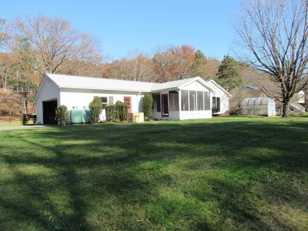144 Harvard Road Stow, MA 01775 - Photo 24 of 40 a front view of house with yard and green space