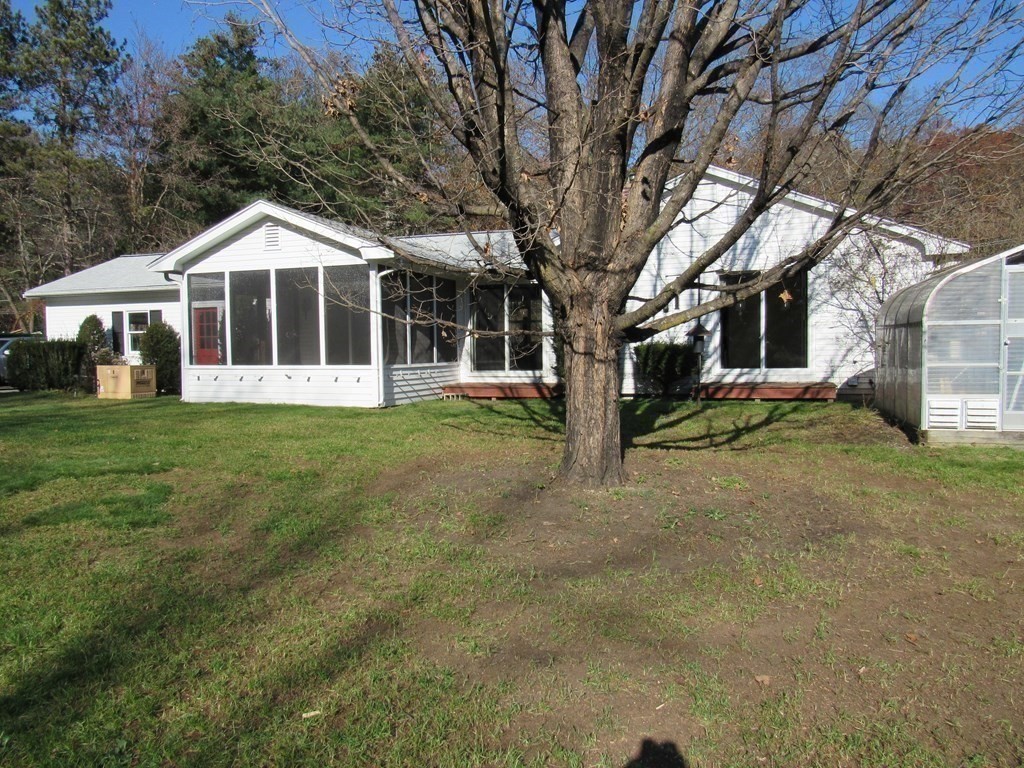 144 Harvard Road Stow, MA 01775 - Photo 26 of 40 a front view of a house with a yard