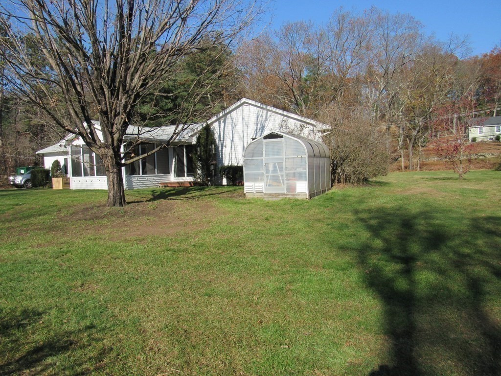 144 Harvard Road Stow, MA 01775 - Photo 27 of 40 a view of a house with a yard