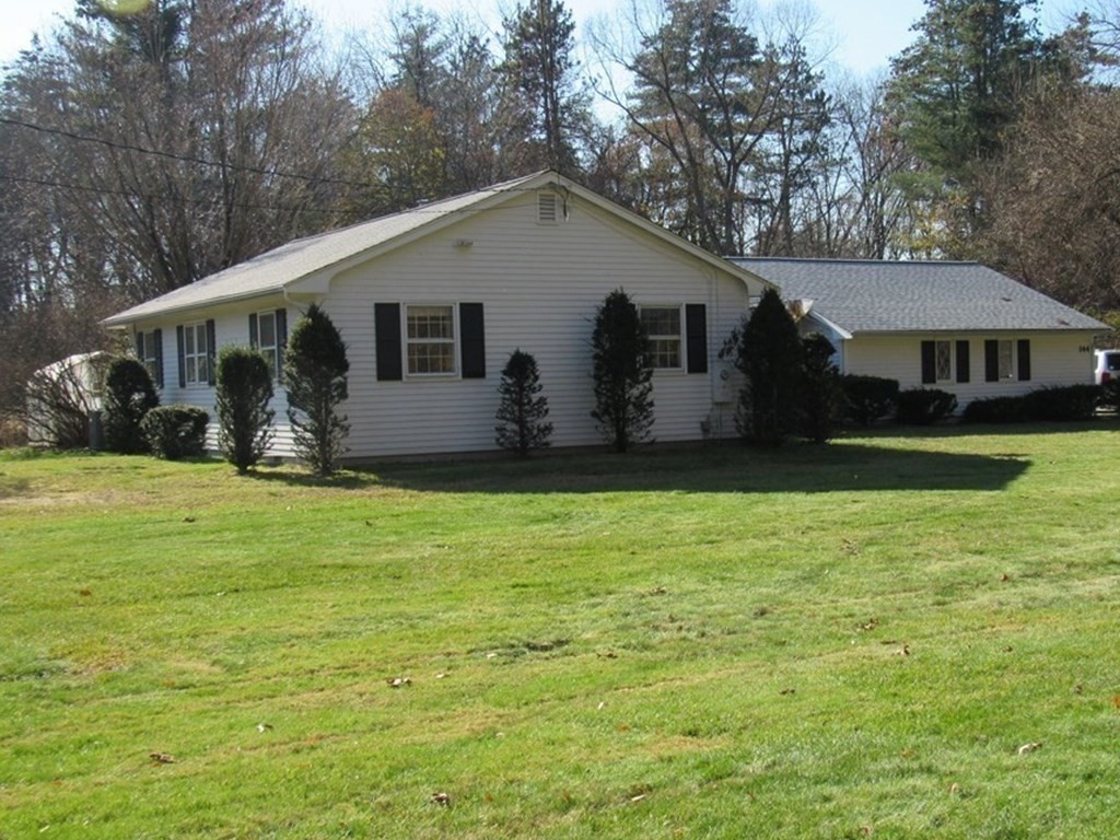 144 Harvard Road Stow, MA 01775 - Photo 3 of 40 a house view with a garden space