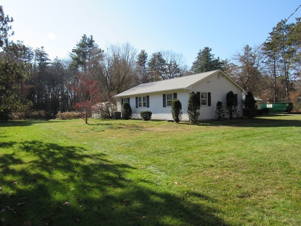 144 Harvard Road Stow, MA 01775 - Photo 4 of 40 a front view of house with yard and green space