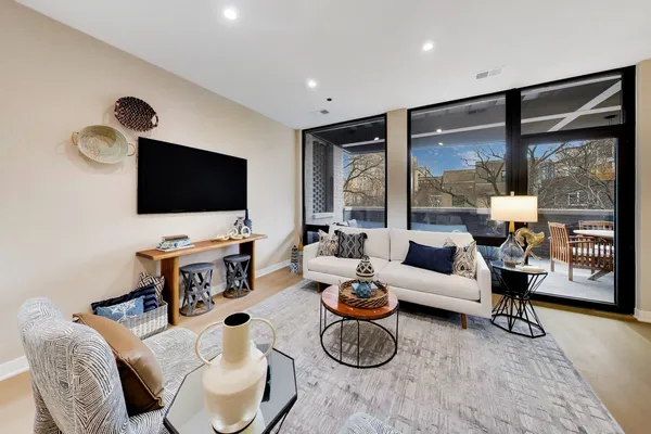a living room with furniture and a large window