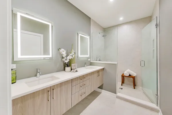 a bathroom with a sink a vanity and a mirror