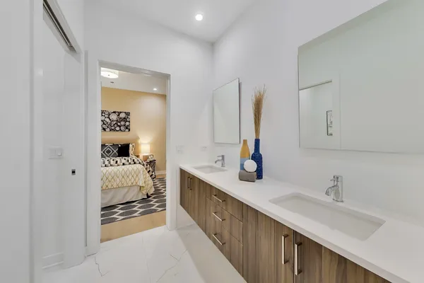 a white toilet sitting next to a bath tub