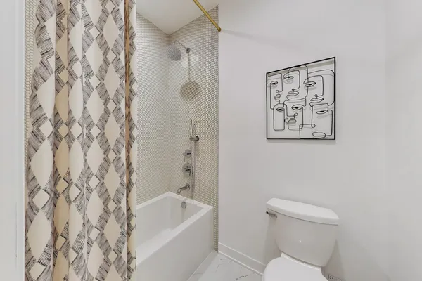 a en suite bathroom with a sink and a mirror