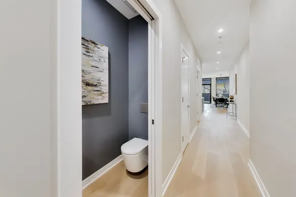 a view of a hallway with washer and dryer