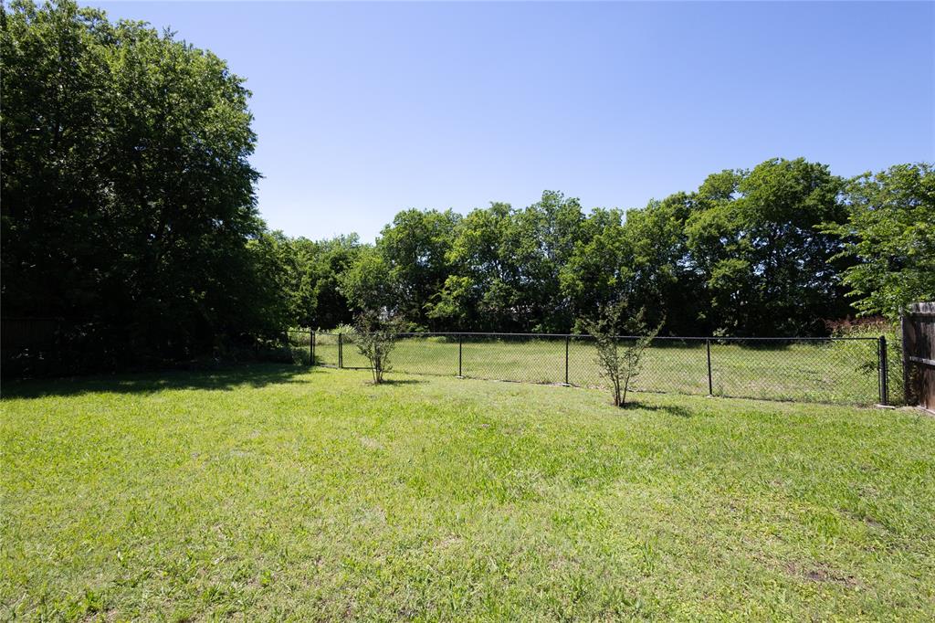 512 Milton Road Josephine, TX 75173 - Photo 29 of 31 a swimming pool with trees in the background