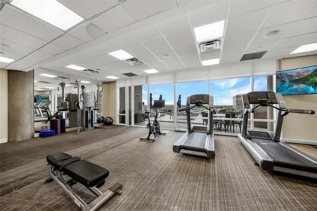 a room with gym equipment and a table