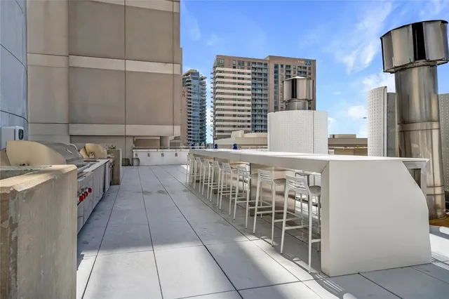 a utility room with multiple dryer and washer