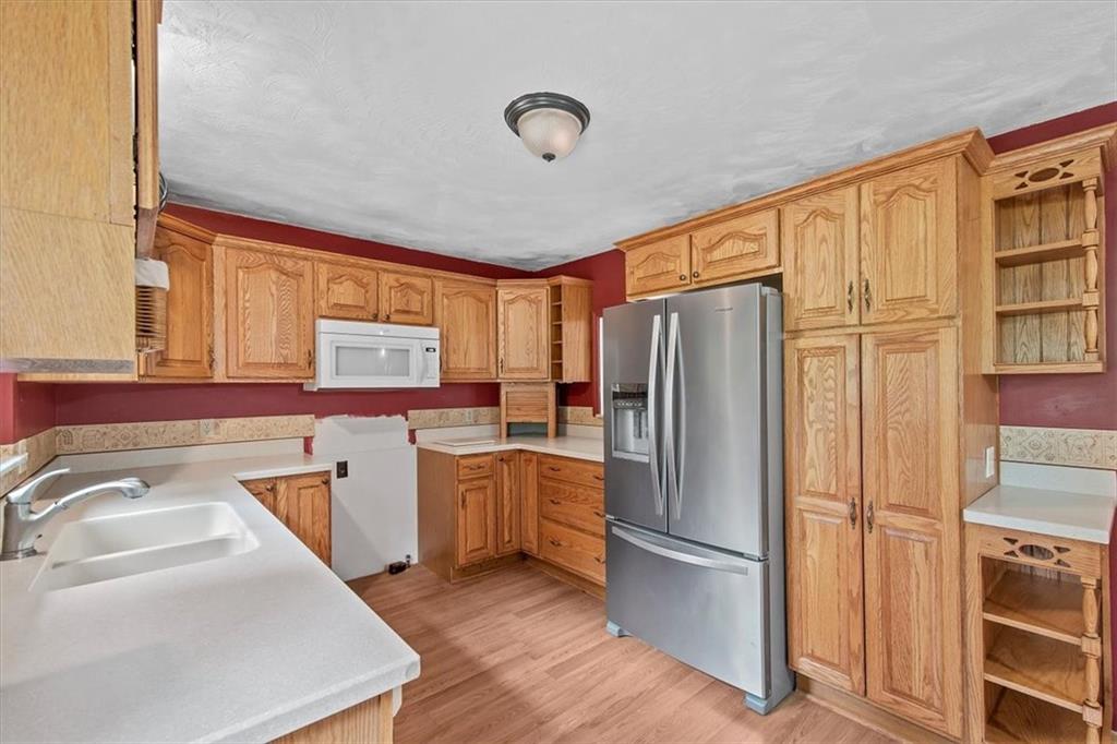 203 Myers Road Vandergrift, PA 15690 - Photo 8 of 25 a kitchen with stainless steel appliances granite countertop a refrigerator and a sink