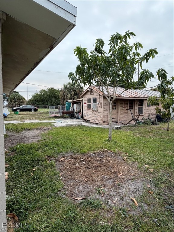 1126 Florida Avenue Clewiston, FL 33440 - Photo 13 of 13 a view of a house with a yard