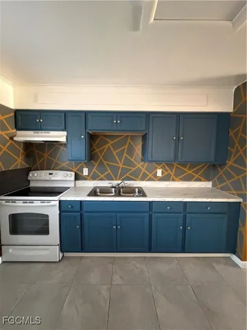 a view of kitchen with stainless steel appliances granite countertop a sink and a stove